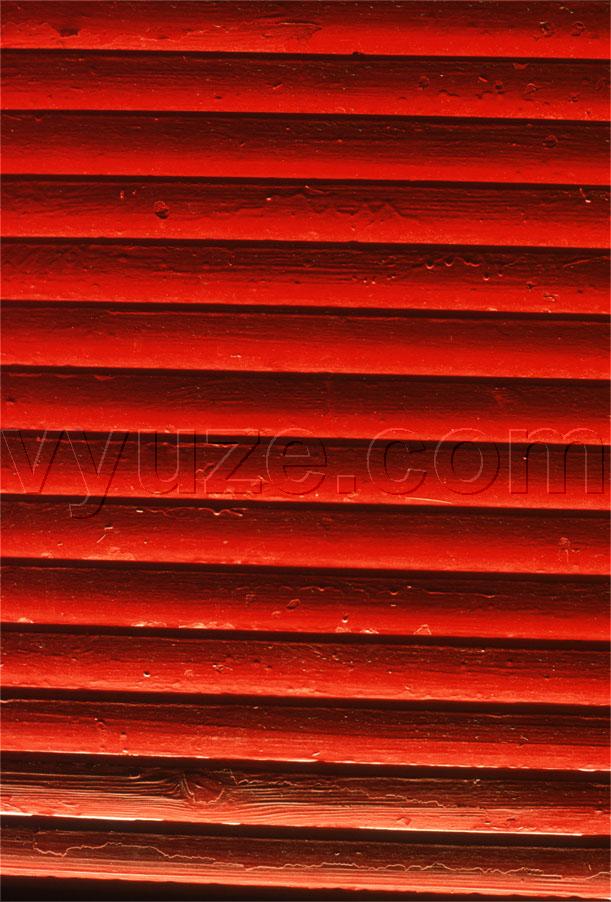 Light coming through red shutters / Location: Greece