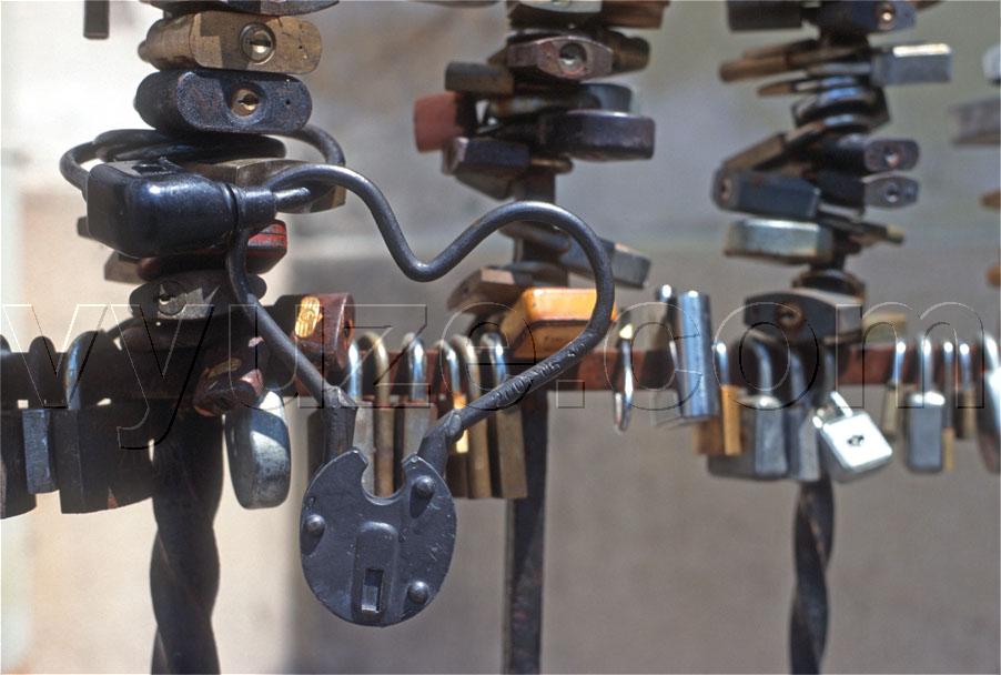 Locks on the railings of the bishop's palace / The tradition is for lovers to put a lock on the railings and throw away the key.  Then they will never part.  Look for the combination lock in some of the images. / Location: Pecs, Hungary