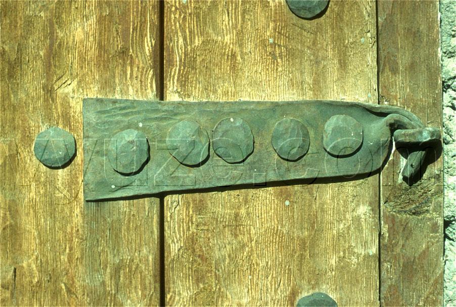 Metal fittings on wooden door / Location: Greece