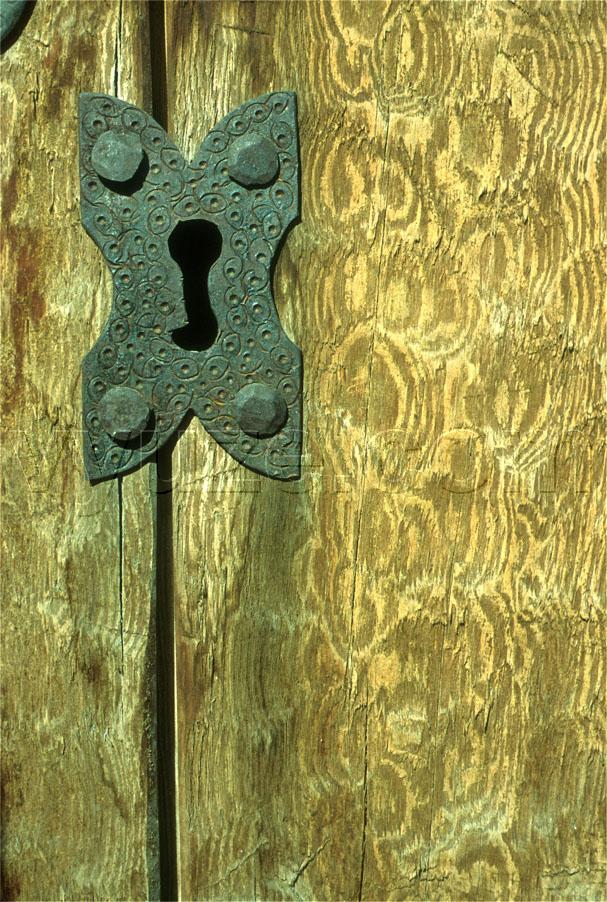 Metal fittings on wooden door / Location: Greece