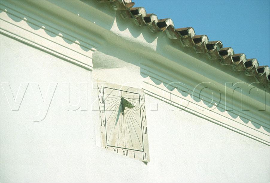 Sundial built into building wall