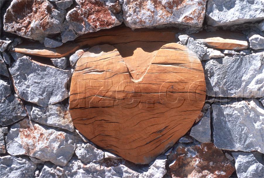 Wooden heart set in a stone wall / Location: Agia Roumeli, Crete, Greece
